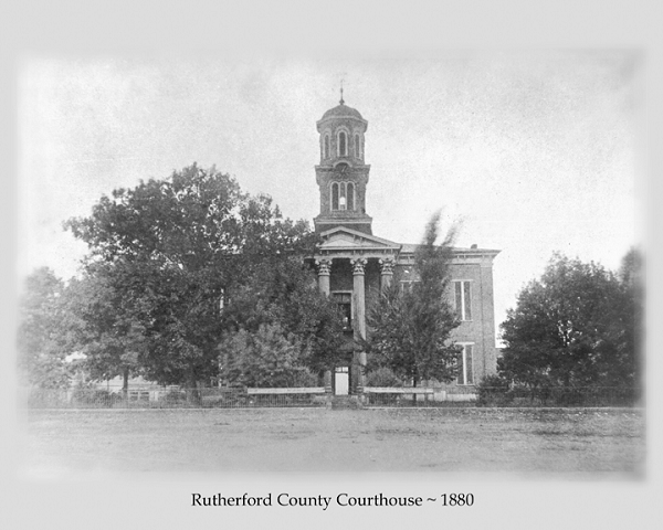 Black and White photo of Rutherford County's Courthouse in 1880, surrounded by trees.